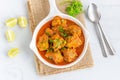 Spicy Indian Chicken Curry Garnished with Cilantro and Lemon Royalty Free Stock Photo