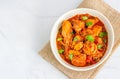 Spicy Indian Chicken Curry Served in a Bowl on the Burlap, Garnished with Lemon and Cilantro Royalty Free Stock Photo