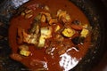 Spicy kerala style fish curry in clay pot. Royalty Free Stock Photo