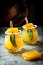 Spicy mango popsicle margarita cocktail with jalapeno and lime. Mexican alcoholic drink for Cinco de mayo party. Royalty Free Stock Photo