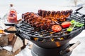 Spicy marinated spare ribs grilling outdoors Royalty Free Stock Photo