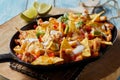 Spicy Mexican chicken with nachos and cream