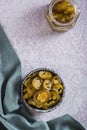 Spicy mexican pickled jalapeno peppers in bowl and glass jar top and vertical view Royalty Free Stock Photo