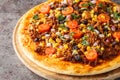 Spicy Mexican Taco pizza with ground beef, tomatoes, corn, black beans, cheddar cheese, red onion on the wooden board. Horizontal Royalty Free Stock Photo