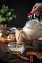 Spicy milk Indian tea Masala poured into a glass from a teapot Royalty Free Stock Photo