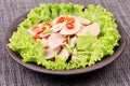 Spicy mixed vegetable salad with sliced Thai white pork sausage Royalty Free Stock Photo