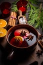 Spicy mulled wine with orange, apple, cinnamon and anise in pot Royalty Free Stock Photo