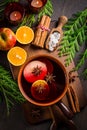 Spicy mulled wine with orange, apple, cinnamon and anise in pot Royalty Free Stock Photo