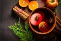 Spicy mulled wine with orange, apple, cinnamon and anise in pot Royalty Free Stock Photo