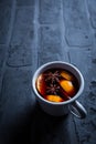 Spicy mulled wine with orange, cinnamon and anise in mug Royalty Free Stock Photo