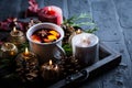 Spicy mulled wine with orange, cinnamon and anise in mug Royalty Free Stock Photo