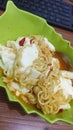 Spicy noodles with egg and ghost chilli,