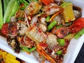 spicy papaya and corn salad with black crab Thailand  called farmer crab and fresh shrimp Royalty Free Stock Photo