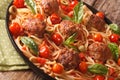 Spicy pasta with meatballs, olives, basil and tomato sauce close Royalty Free Stock Photo