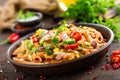 Spicy pasta penne bolognese with vegetables, beans, chili and cheese in tomato sauce Royalty Free Stock Photo