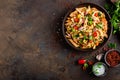 Spicy pasta penne bolognese with vegetables, beans, chili and cheese in tomato sauce Royalty Free Stock Photo