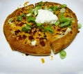Spicy perogy pizza with sour cream