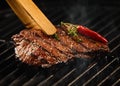 Spicy portion of seared steak grilling on a BBQ Royalty Free Stock Photo