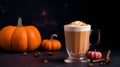 Spicy pumpkin latte with whipped cream and cinnamon over dark background with autumn leaves. A glass of creamy coffee with pumpkin