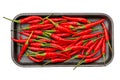 Spicy red hot peppers on black tray isolated Royalty Free Stock Photo