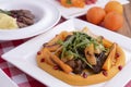 Spicy roast beef, mango and avocado salad. With salad greens and red onions. Table served for thanksgiving dinner. Royalty Free Stock Photo