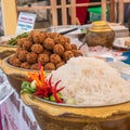 Spicy salad of curried rice croquettes