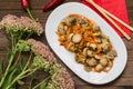 Spicy salad of mushrooms and carrots in Korean. Top view. Close-up. Wooden rustic background. Royalty Free Stock Photo