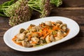 Spicy salad of mushrooms and carrots in Korean. Top view. Close-up. Wooden rustic background. Royalty Free Stock Photo