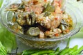 Spicy salmon in green curry eat couple with fresh vegetable on dish