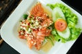 Spicy Salmon Salad with fresh chilli and garlic, Thai food style. Home made food. Concept for a tasty and healthy meal, top view