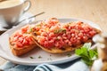 Spicy salsa topping and coriander on tostada