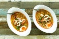 Spicy seafood soup with noodle and boiled egg Royalty Free Stock Photo