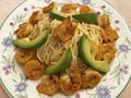 Spicy Shrimp With Avocado Slices Served Over Pasta Royalty Free Stock Photo