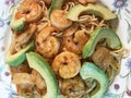 Spicy Shrimp With Avocado Slices on Top of Pasta Royalty Free Stock Photo