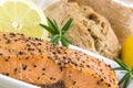 Spicy smoked salmon with lemon, rosmarin and bread bun