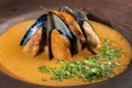 Spicy soup of mashed potatoes with mussels from the pumpkin with greens.