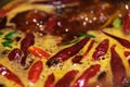 Spicy soup and red peppers in Chinese hotpot