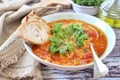 Spicy split pea soup with cabbage kale, olive oil and bread