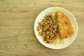 Spicy stir fried chop pork with chili and basil leaf mixed rice topping crispy egg omelette on plate Royalty Free Stock Photo