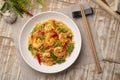 Spicy stir fried instant noodle with shrimps and thai basil leaves Royalty Free Stock Photo