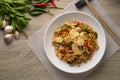 Spicy stir fried instant noodle with sliced chicken breast and thai basil leaves in white plate.top view Royalty Free Stock Photo