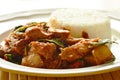 Spicy stir fried roasted pork curry with herb eat couple with rice on dish