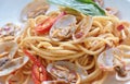 spicy stir fried spaghetti clams with pepper and basil leaf on plate Royalty Free Stock Photo