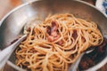 Spicy stir-fried spaghetti with fresh chilies, peppers, basil leaves and spaghetti