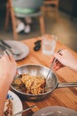 Spicy stir-fried spaghetti with fresh chilies, peppers, basil leaves and spaghetti