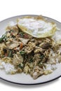 Spicy stir-fry beef with the holy basil topping with fried egg Royalty Free Stock Photo