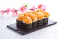 Spicy sushi roll on a stone plate Royalty Free Stock Photo