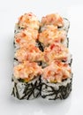 Spicy sushi rolls in nori on white background Royalty Free Stock Photo