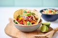 spicy taco salad in a tortilla bowl with cheese Royalty Free Stock Photo