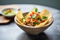 spicy taco salad in a tortilla bowl with cheese Royalty Free Stock Photo